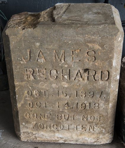 Headstone found under the covered entranceway to the basement level of the Call-Collins House. Research indicates that James Rechard was buried in East Grove Cemetery in Woodville, Florida. This salvaged headstone either contained a mistake, or was replaced with a newer one. Photo by Ray Stanyard