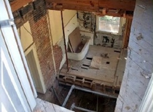 renovation of 1950s era bathrooms to make way for elevator shaft.