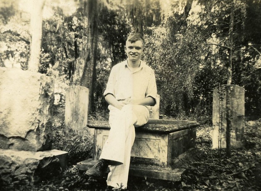 Anthony Jensen sitting in the cemetery in about 1940. 