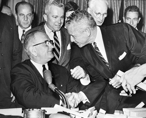 LeRoy Collins with President Johnson at the signing of the Civil Rights Act, 1964.