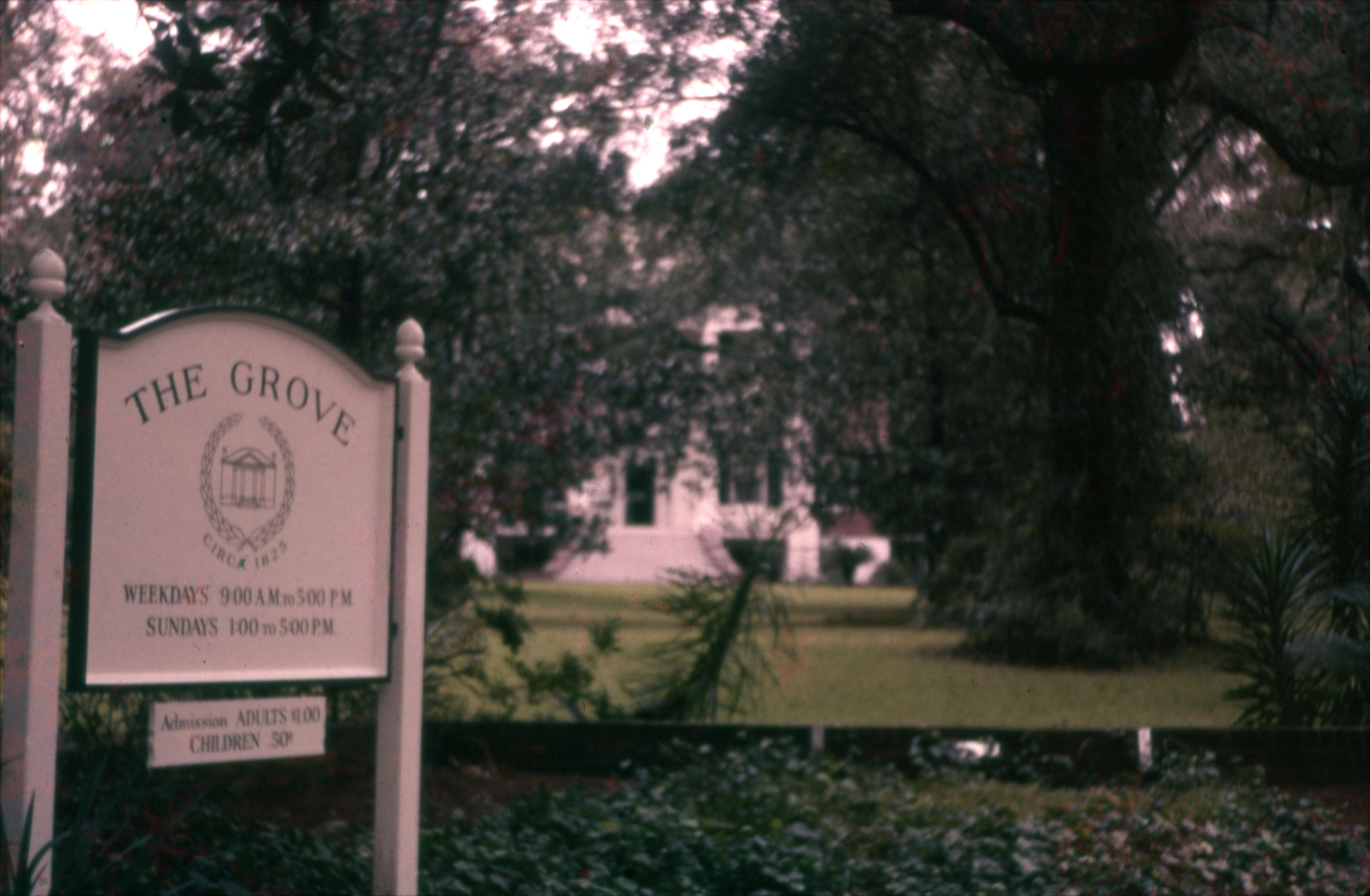 This photograph shows signage for the first Grove Museum, which opened for tours while LeRoy and Mary Call Collins, the final residents of the home, lived in Washington, D.C. 
